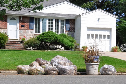 Office worker handling commercial waste complaint paperwork in Hampstead service area