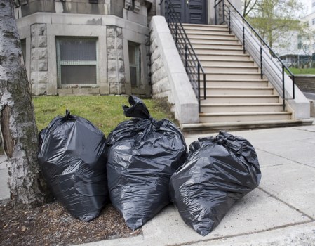 Workers managing construction debris in Hampstead