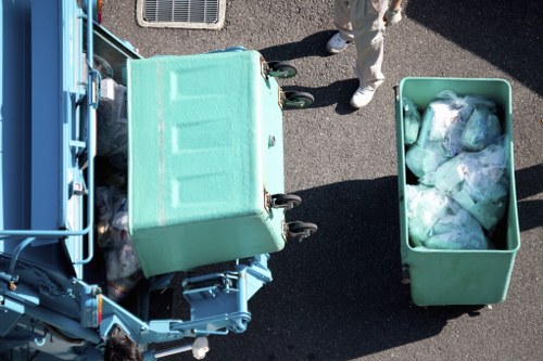 Commercial waste crew at work with bins